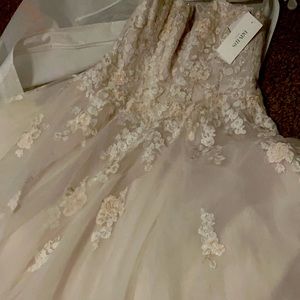Brand new never worn wedding dress from David bridal